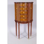 A contemporary mahogany shaped front dressing chest, with five fitted drawers flanked by two