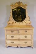 A Victorian pine dressing table with shield shaped mirror and applied composition decoration,