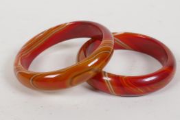 A pair of agate bangles, 3" diameter