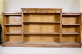 A C19th oak breakfront library bookcase with Aesthetic style decoration, 98" x 15", 49" high