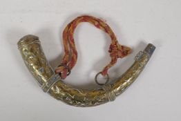 An antique middle eastern brass powder horn, 11" wide