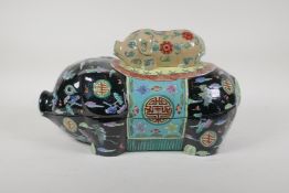 A Chinese famille noir ceramic pig shaped tureen, with enamelled auspicious symbol, bat and