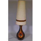 A mid C20th ceramic table lamp with tall shade, 56½" high overall