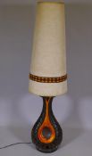 A mid C20th ceramic table lamp with tall shade, 56½" high overall