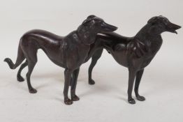 A pair of bronze figures of hounds, 6½" long