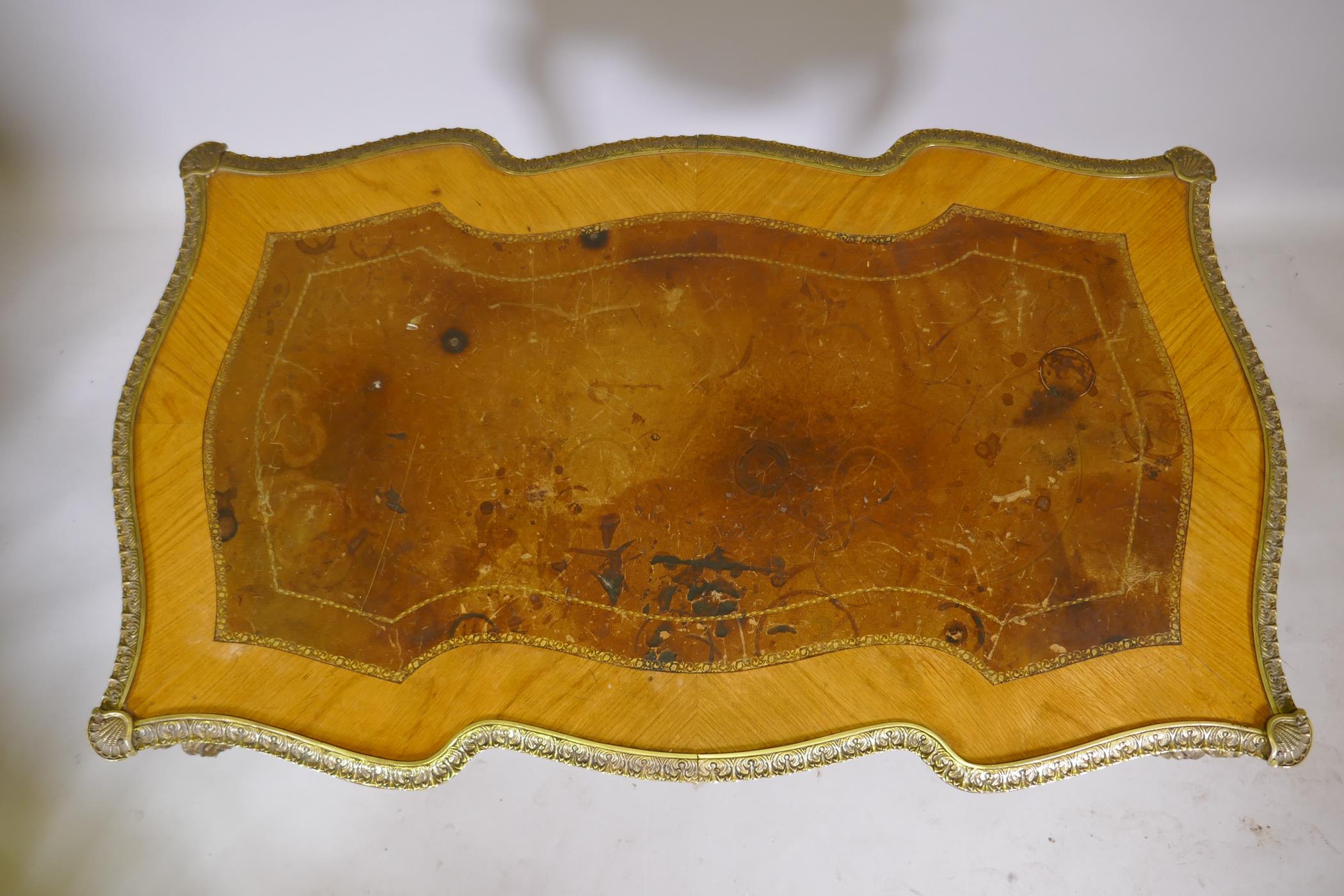 A Louis XV style inlaid tulipwood and brass mounted writing table, with inset leather top and three - Image 2 of 9