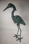 A verdigris metal garden figure of a heron, 33" high