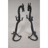 A pair of detailed Chinese bronze figures of dragons, 15½" high