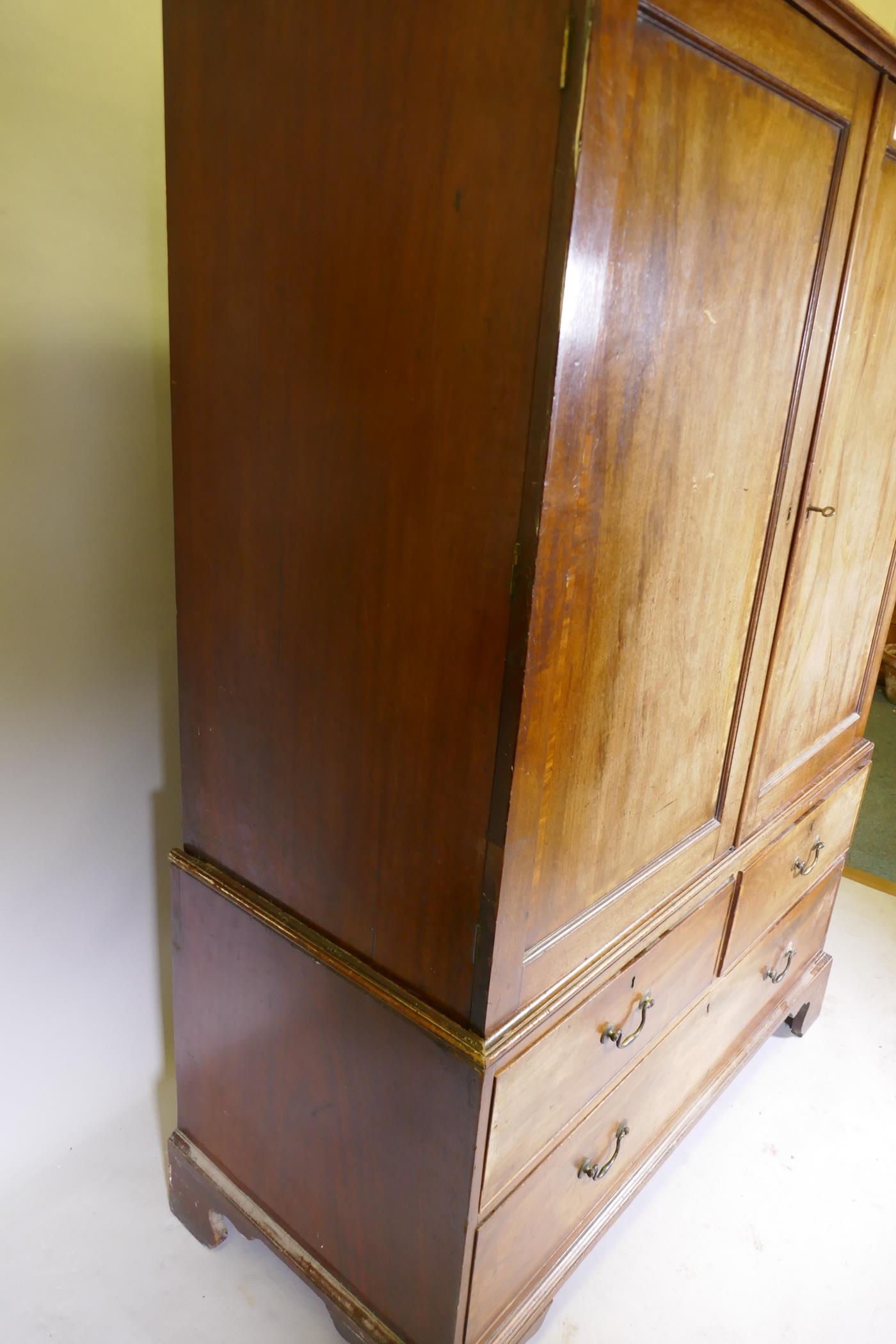 A George III mahogany linen press of small proportions, the doors and drawers with crossbanded inlay - Image 6 of 6