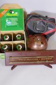 Four Henselite lawn bowls, medium, deluxe, a Columbia 300 tenpin bowling ball in bag, and a