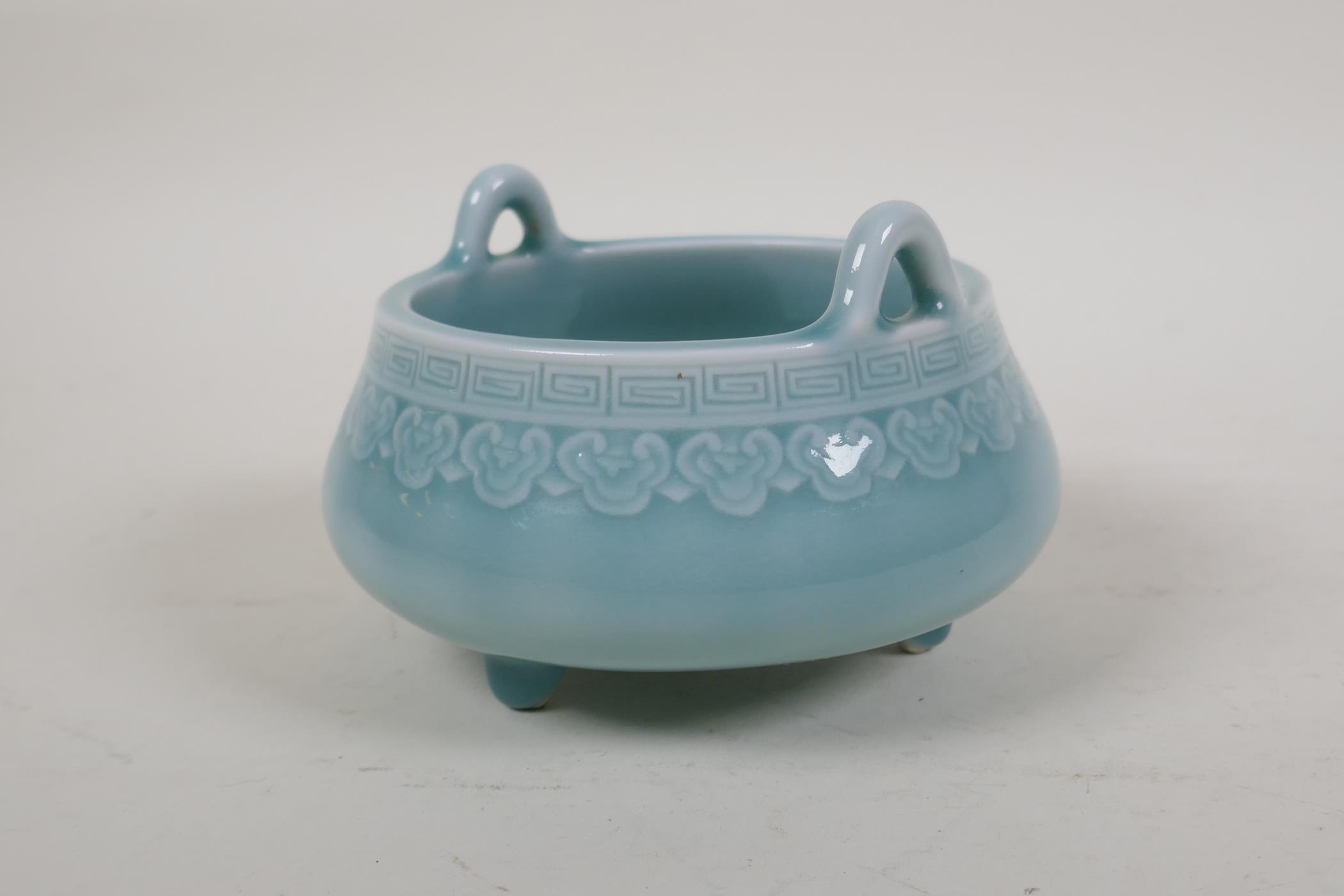 A duck egg blue glazed porcelain two handled censer on tripod supports, underglaze Chinese - Image 2 of 4