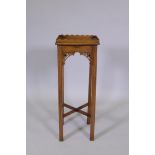A C19th mahogany Chinese Chippendale style urn stand with shaped gallery, pierced brackets and