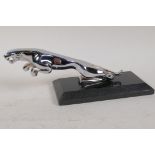 A replica chrome plated Jaguar car mascot, on marble base, 9" long