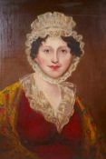 A C19th portrait of a lady in a lace bonnet, oil on canvas laid on board, 19" x 24"