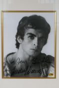 A signed black and white photograph of Rudolf Nureyev, with certificate of authenticity, framed, 7½"
