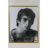 A signed black and white photograph of Rudolf Nureyev, with certificate of authenticity, framed, 7½"