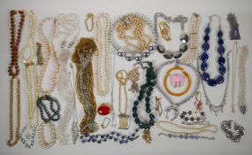 A quantity of vintage costume jewellery, mostly necklaces
