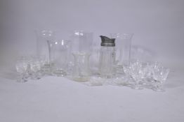 A quantity of glass vases, water jug and crystal drinking glasses