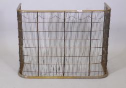 A brass fire guard, 32" x 14" x 24"