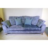 A contemporary sofa, raised on tapering supports, 90" x 39" x 28" high
