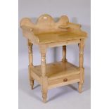 A C19th pine washstand with galleried top and base drawer on turned supports, 38½" x 27" x 19½"