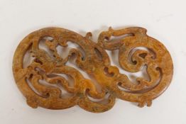 A Chinese carved hardstone dragon pendant, 4½" long