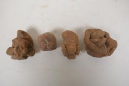 Four antique Indian terracotta busts, 3"