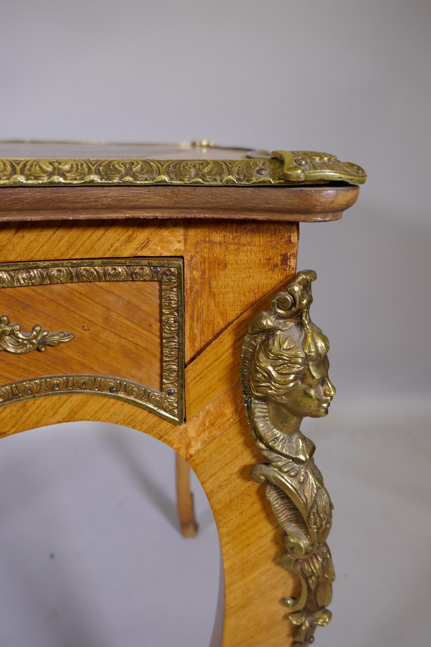 A Louis XV style inlaid tulipwood and brass mounted writing table, with inset leather top and three - Image 5 of 9