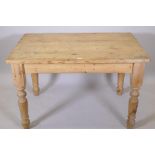 A pine scullery table, raised on turned supports, 48" x 33" x 31"