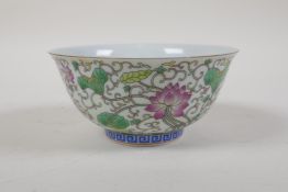 A polychrome porcelain rice bowl with lotus flower decoration, Chinese GuangXu character mark to