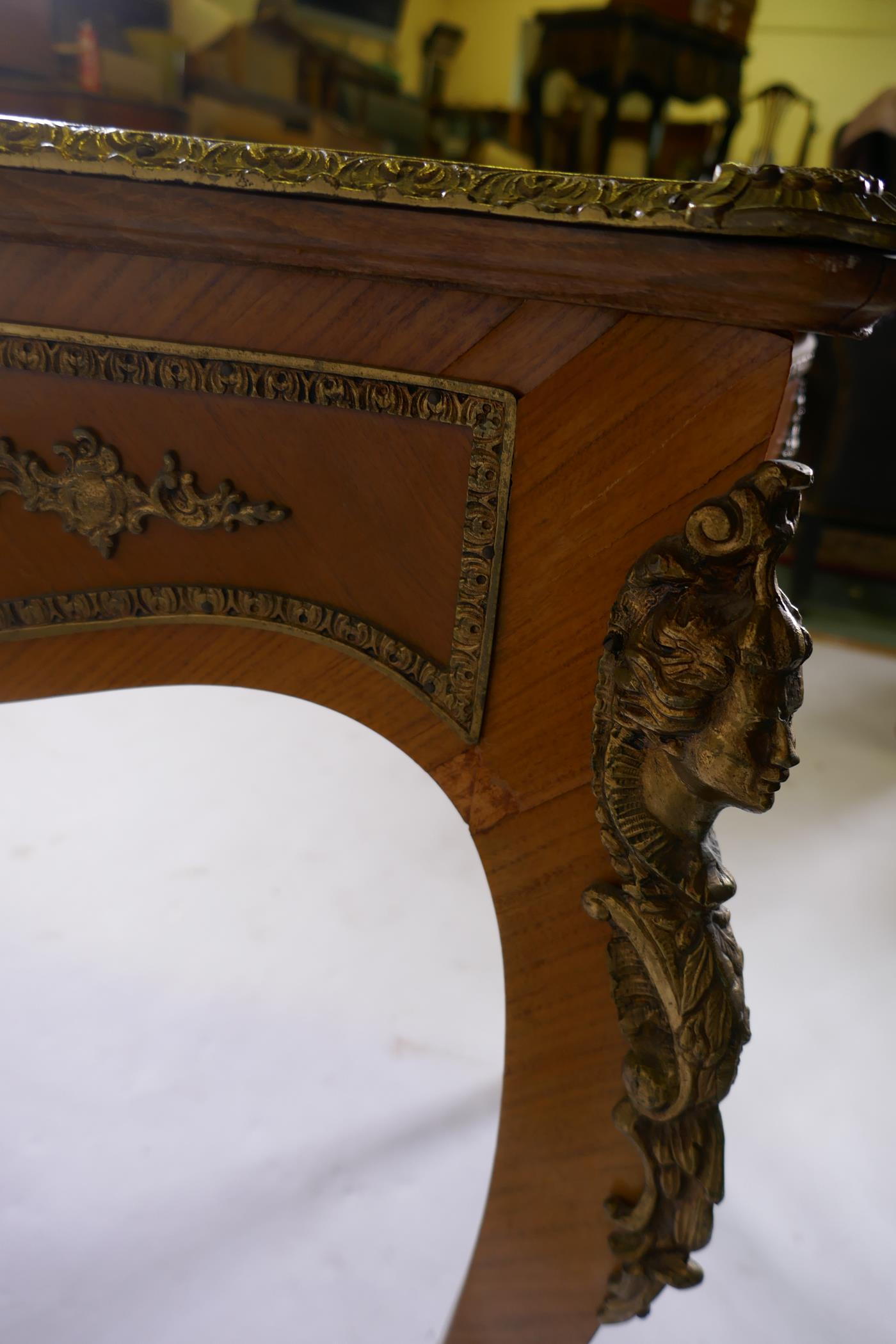 A Louis XV style inlaid tulipwood and brass mounted writing table, with inset leather top and three - Image 7 of 9