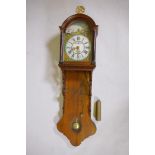 A C19th Dutch Frisland tall wall clock, with painted dial and alarm, striking on a bell, 55" long