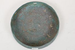 A Persian metal shallow bowl with repousse embossed decoration, 6½" diameter