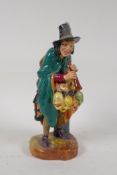 A Royal Doulton figure, The Mask Seller, HN2103, 8½" high
