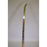 A Japanese Meiji period Naginata weapon with hardwood shaft and steel blade with inscribed tang,