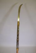 A Japanese Meiji period Naginata weapon with hardwood shaft and steel blade with inscribed tang,