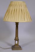 A brass Corinthian column table lamp, with pleated silk shade, 26" high to top of shade