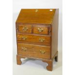 A Georgian style mahogany fall front bureau of small proportions, with two short over two long