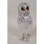 A silver plated sugar sifter in the form of an owl with glass eyes, 6" high