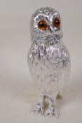 A silver plated sugar sifter in the form of an owl with glass eyes, 6" high