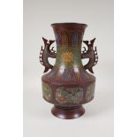 A Japanese coppered bronze two handled vase of archaic design, with cloisonne panelled decoration of
