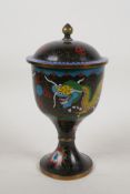 A Chinese cloisonne goblet and cover decorated with dragons chasing the flaming pearl, 9" high