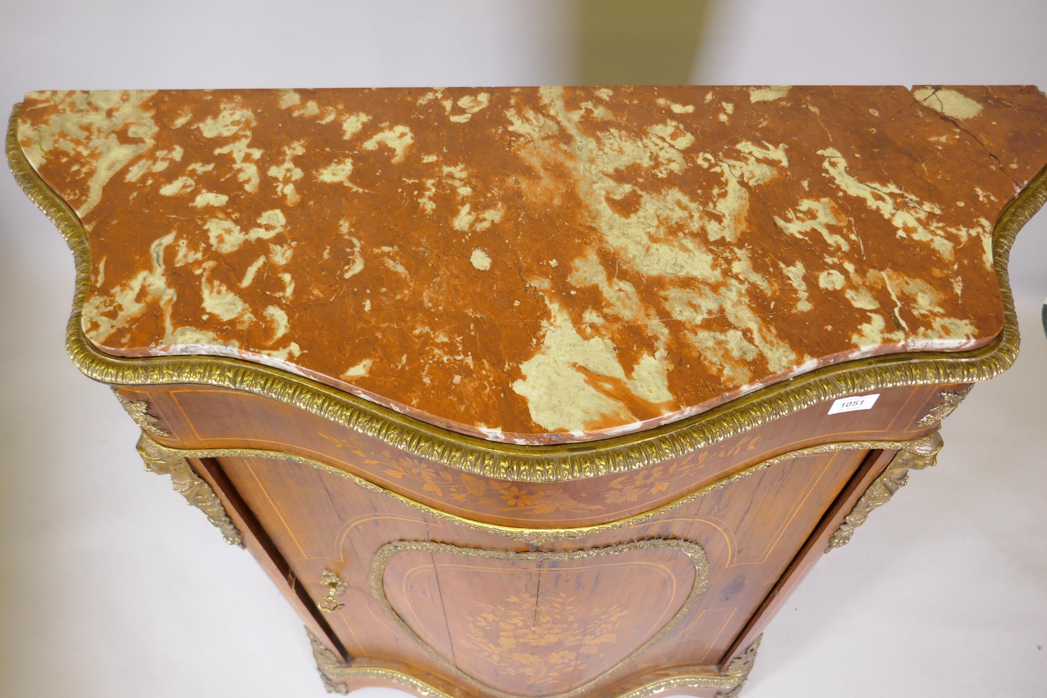 A French marquetry inlaid serpentine front rosewood cabinet with ormolu mounts and marble tops, - Image 5 of 12