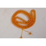 A faux amber bead necklace, 42" long
