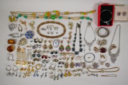 A quantity of vintage costume jewellery including numerous pairs of earrings
