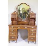 Shapland & Petter of Barnstaple, inlaid mahogany kneehole dressing table with shield shaped