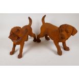 A pair of cast iron figures of puppies, 13" long