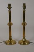 A pair of C19th brass candlesticks converted to lamps, 15" high