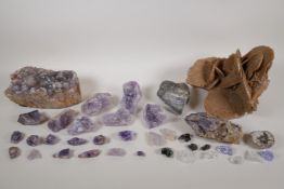 A collection of assorted geological samples including a quantity of amethyst geodes, a desert