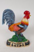 A brightly painted cast iron door stop in the form of a cockerel, 13" high